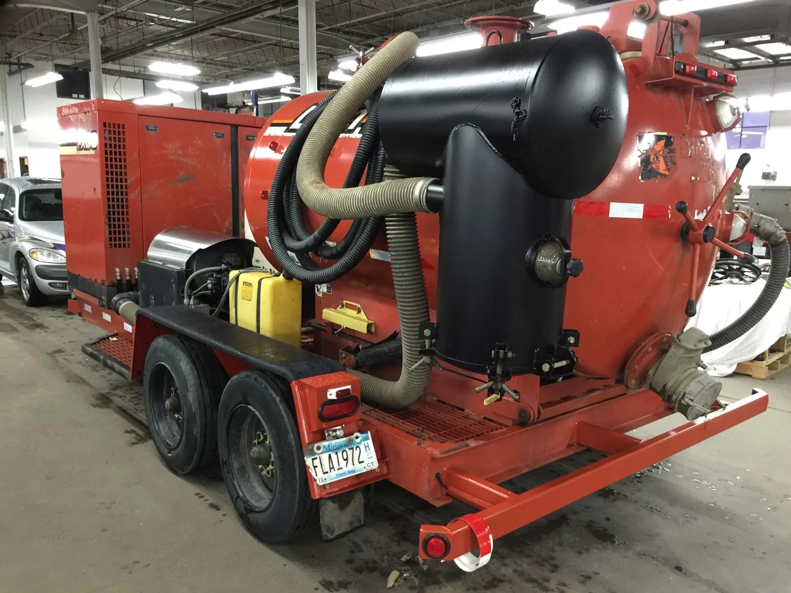 A red trailer-mounted fleet unit from Auto Truck Service Co.'s work gallery